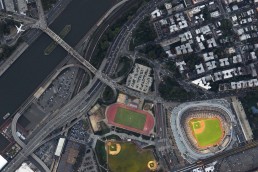 As the Yankees game starts, an airliner arrives to La Guardia airport